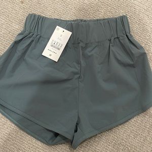 High Waisted Dolphin Hem Casual Shorts 2” in color Blue Spruce